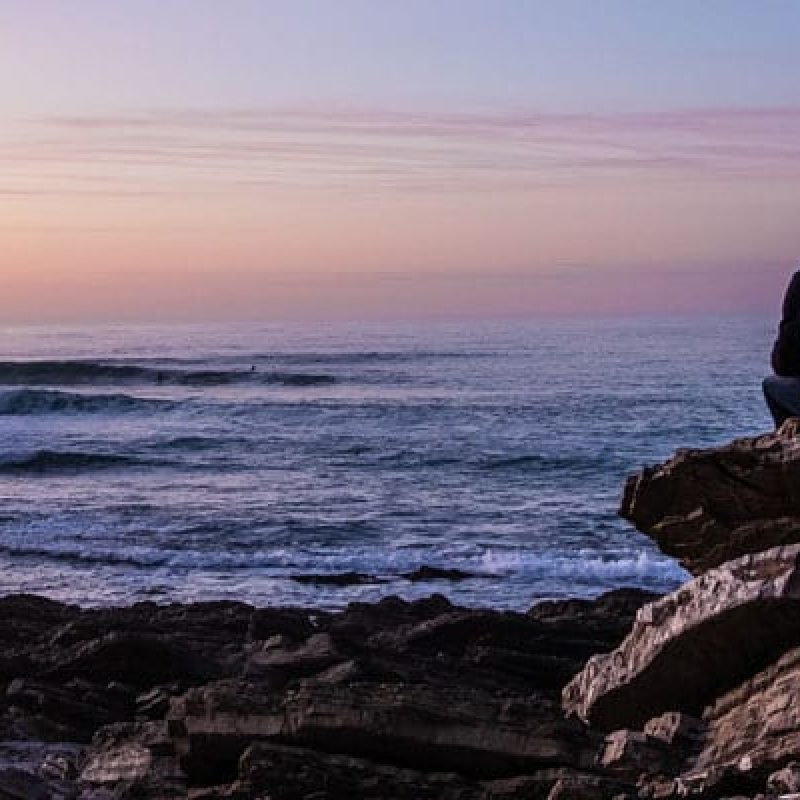 man-contemplating-water
