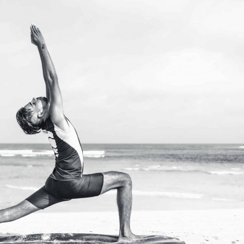 Man poses in yoga