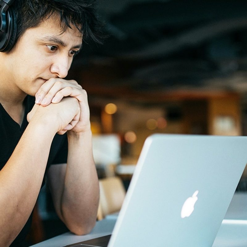 young man online on a computer