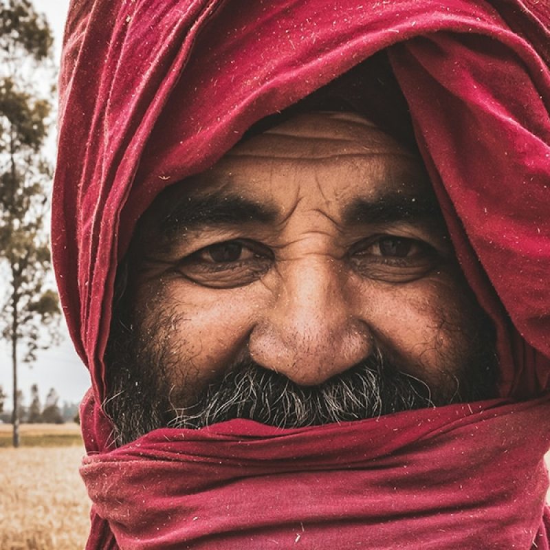 man wearing a red face covering
