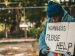 A homeless man with a sign.