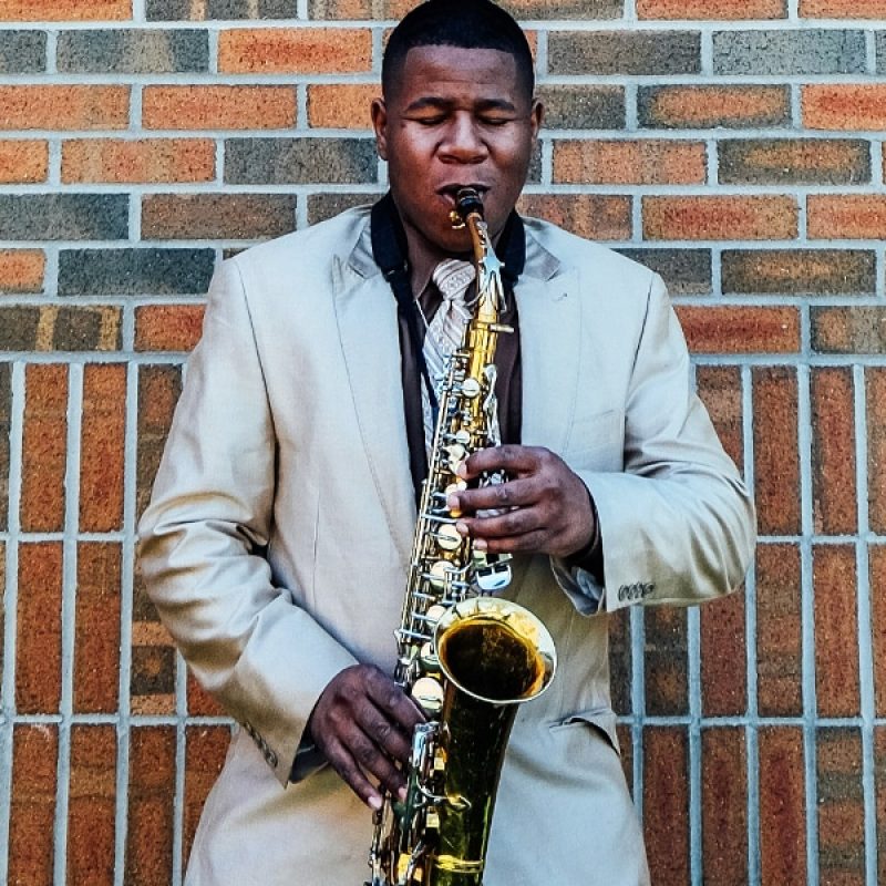 man playing jazz on a saxophone