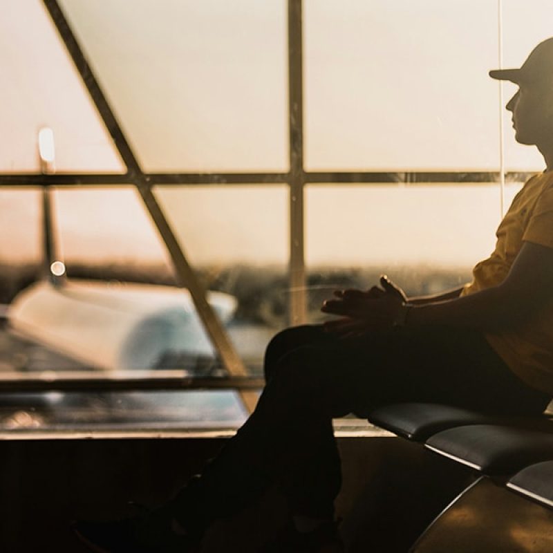 man waiting to board a plane at airport
