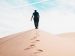 man walking in the desert