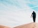 Man walking in the desert.