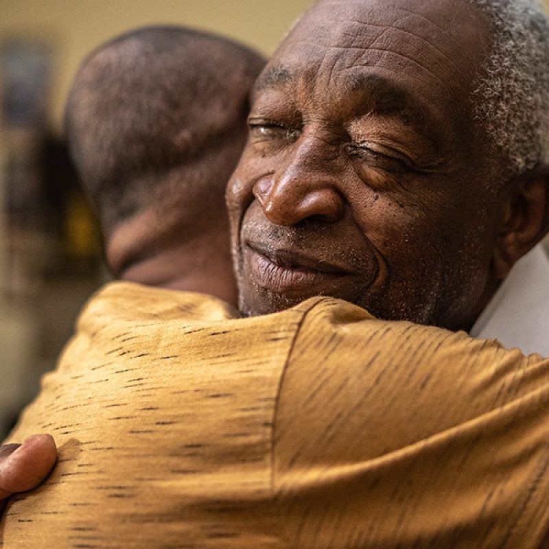 men_hug_encouragement two men hugging, encouraging each other.