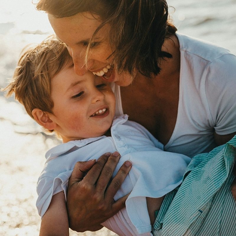 Mom with son at a beach