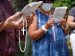 People hold rosaries while participating in a roadside prayer rally marking Religious Freedom Week at St. James Church in Setauket, N.Y., June 24, 2020.