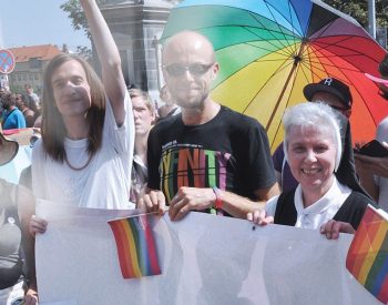 Sister Jeannine Gramick, SL (standing on the right), marches with LGBTQ Catholics in a pride parade in Prague, Czech Republic.