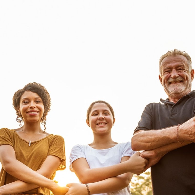 a group of people, community, holding hands in unity.