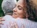 two people in a warm embrace of forgiveness
