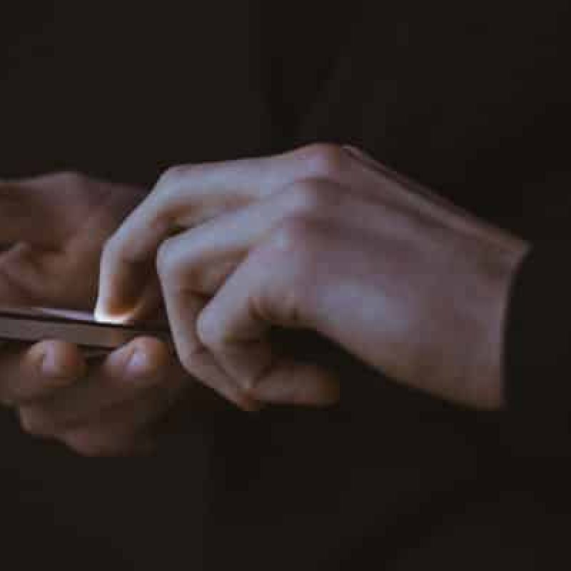 person-messaging-on-phone