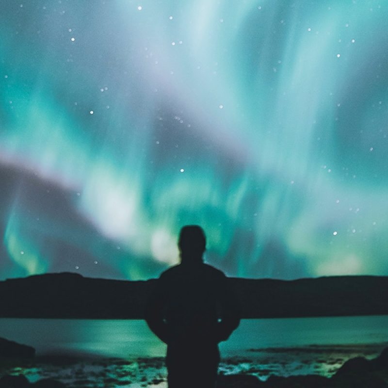 Person looking into the never ending night sky