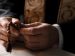 a priest holding a rosary while praying