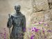 A statue of St. Junipero Serra sits among flowers outside San Carlos Borromeo de Carmelo Mission in Carmel, Calif. The Spanish missionary was canonized by Pope Francis last year under the title of "apostle of California." St. Junipero's feast is July 1. (CNS photo/Nancy Wiechec)