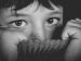 Girl peeking out from sweater pulled up around neck