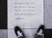 shoes and feet next to word scripture set in stone.