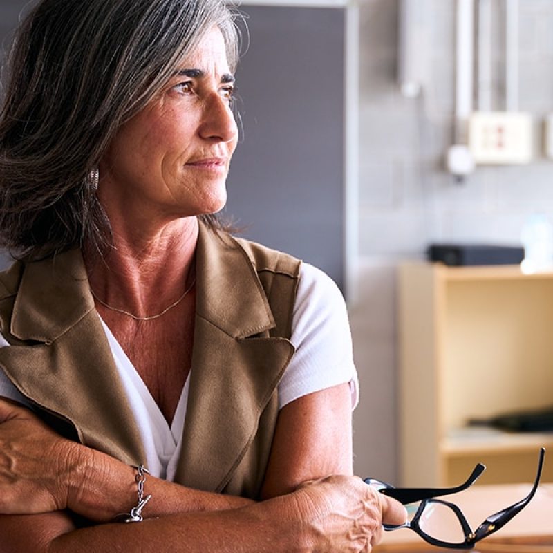 female teacher in a classroom at a school.