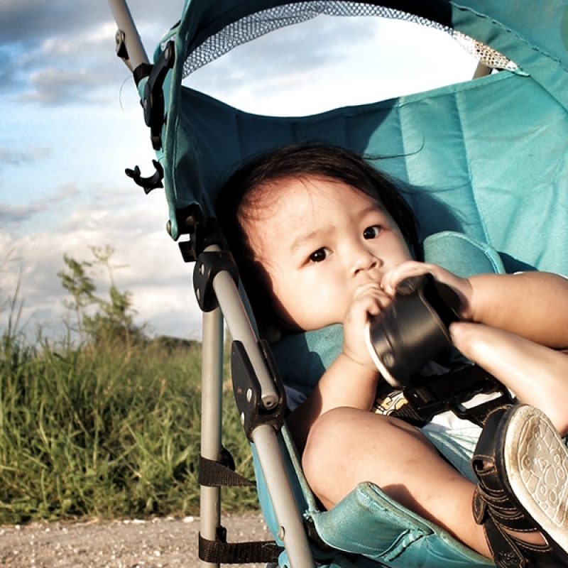the divine child; baby in a stroller.