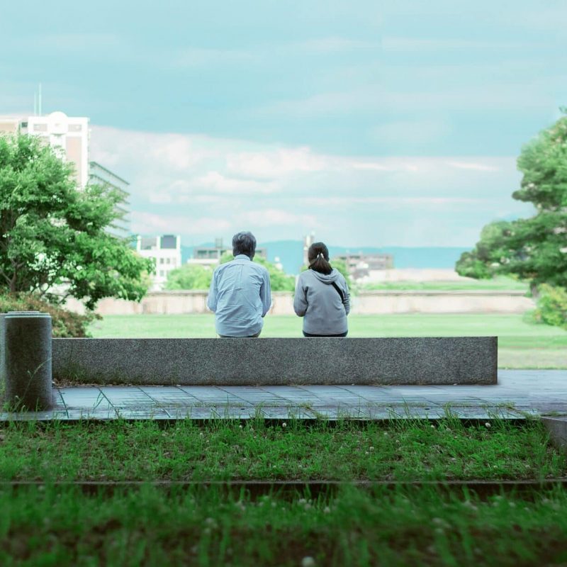 people on a bench Photo by Mojor Zhu on Unsplash