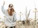 Woman in a field | Photo by Jasmin Ne on Unsplash