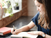 Woman writing in her journal