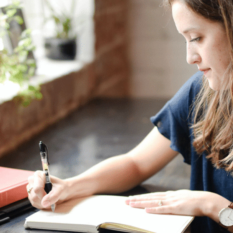 Woman writing in her journal