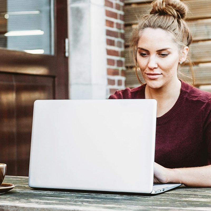 woman reading on her computer