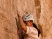 woman courageously rock climbing
