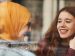 two young diverse woman talking