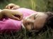 girl lying in the grass