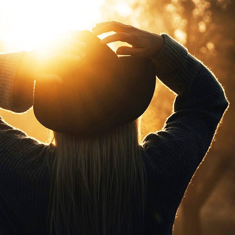 Woman looking at the sun | Photo by 7500 RPM on Unsplash