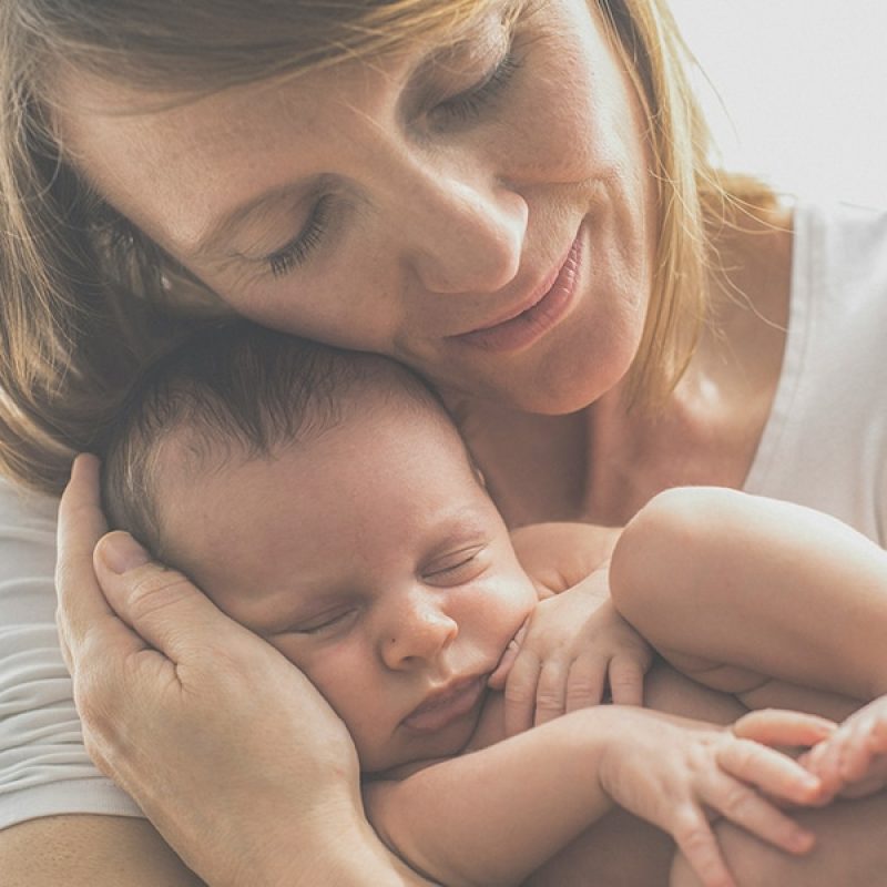 woman holding an infant