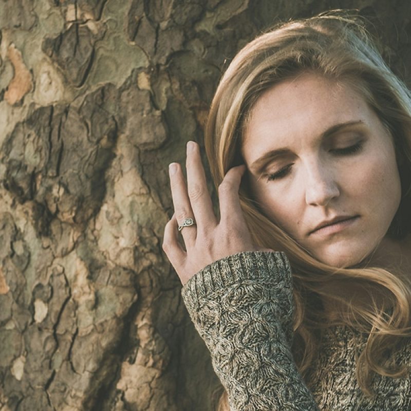 woman with a painful, sad facial expression