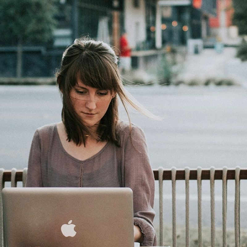 woman reading on her laptop.