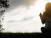 woman sitting in a field in serenity