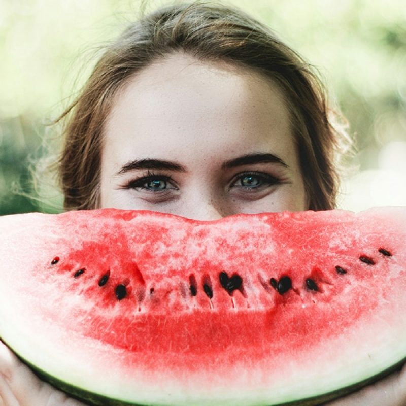 woman eating a watermelon for healthy living