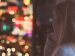 woman looking at lights outside a window